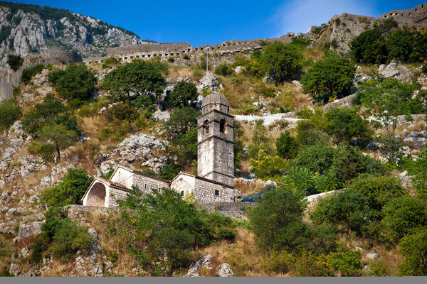 Stone bell tower of Chapel of Our Lady of Salvation above Kotor town and Kotor bay, Montenegro
