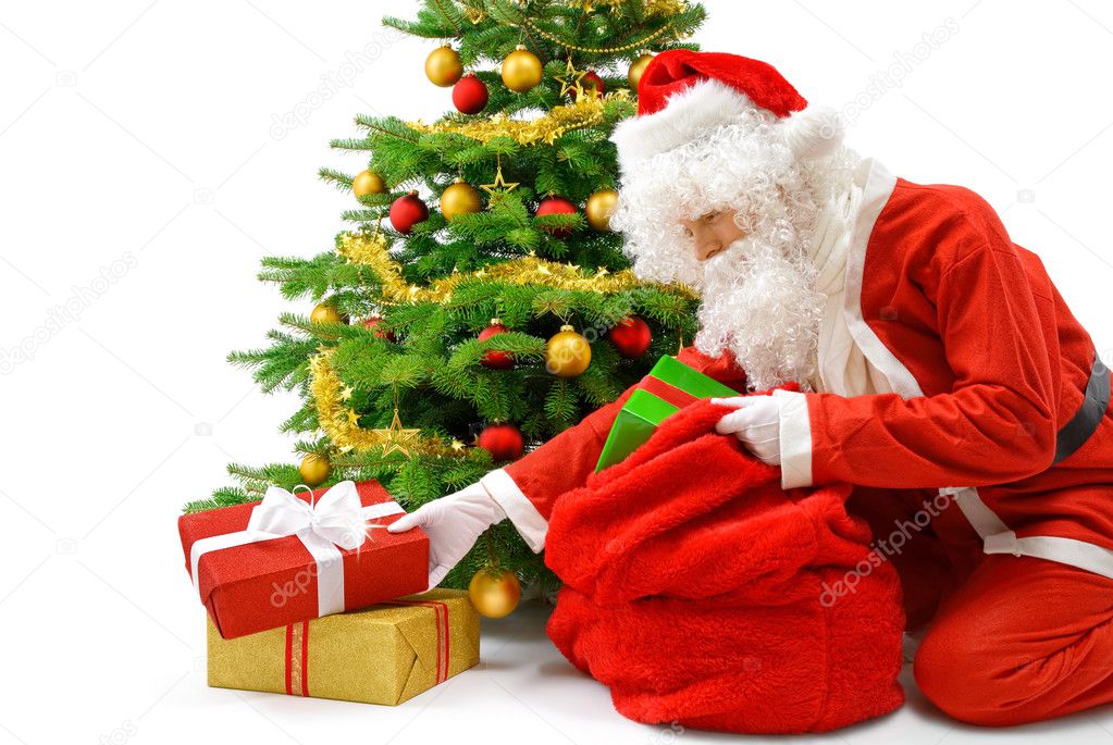 Santa putting the gift boxes under the Christmas tree