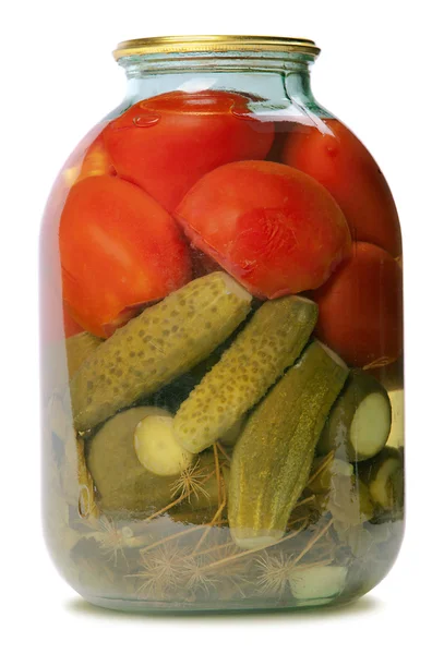 In a glass jar marinaded cucumbers and tomatoes — Stock Image In a glass jar marinaded cucumbers and tomatoes Stock Photo