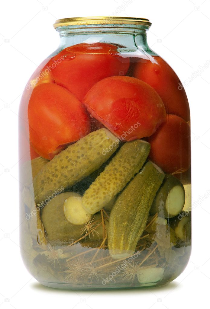 In a glass jar marinaded cucumbers and tomatoes