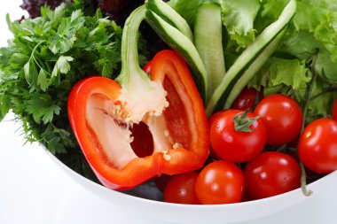 Mediteranian salad on a white restaurant table, closeup clipart