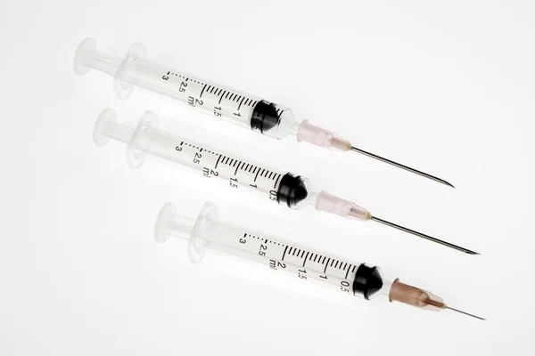 Three syringes in a row — Stock Photo, Image