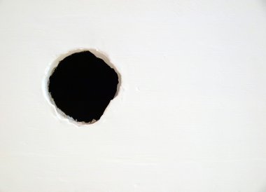 Hole on the white wall clipart