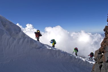 Alpinists in mountains clipart