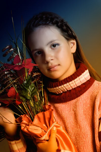 Girl with Christmas flowers — Stock Photo, Image