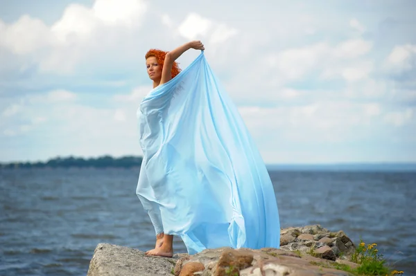 Young woman enjoying the wind — Stock Photo, Image