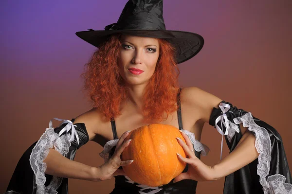 Beautiful red-haired witch Stock Picture