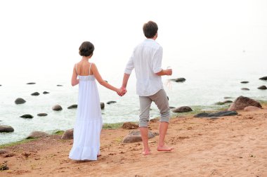 Young romantic pair walks clipart