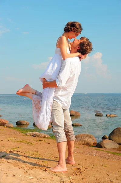 A couple is kissing on the beach Royalty Free Stock Photos