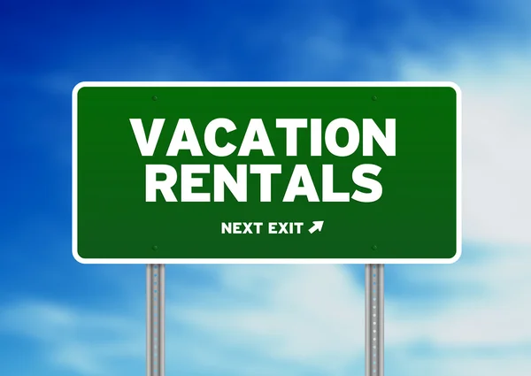 Green Road Sign - Vacation Rentals — Stock Photo, Image