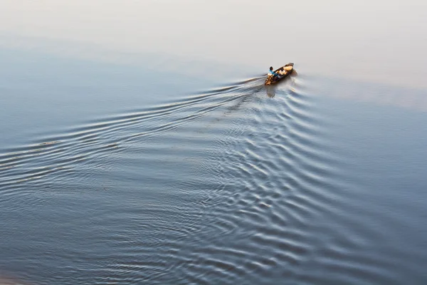 stock image Fishing boat on Moon River in the morning