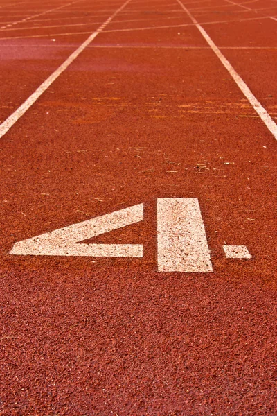 Number four on the start of a running track — Stock Photo, Image