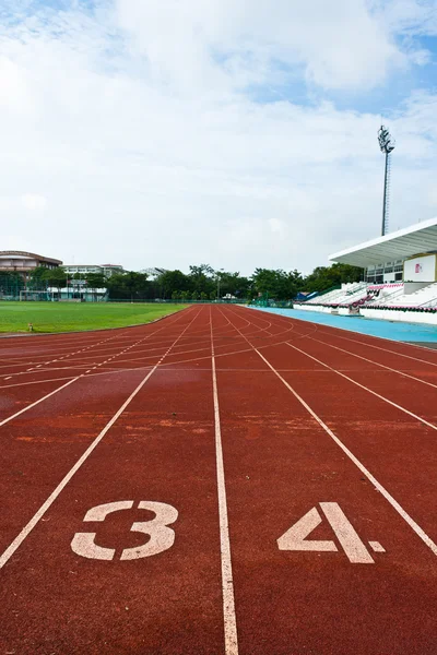 stock image Number three and four on the start of a running track