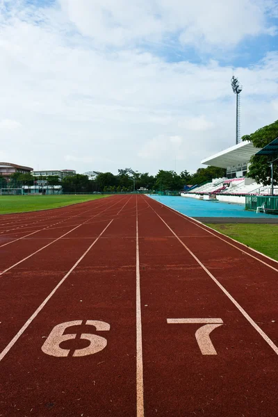 Number six and seven on the start of a running track — Zdjęcie stockowe