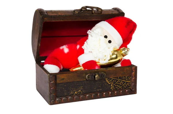 Toy santa klaus in an antiquarian chest — Stockfoto