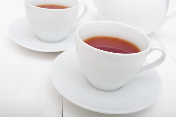 Filiżanki herbaty i czajnik — Zdjęcie stockowe