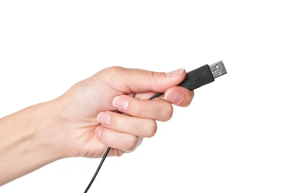 Mão segurando cabo USB preto — Fotografia de Stock