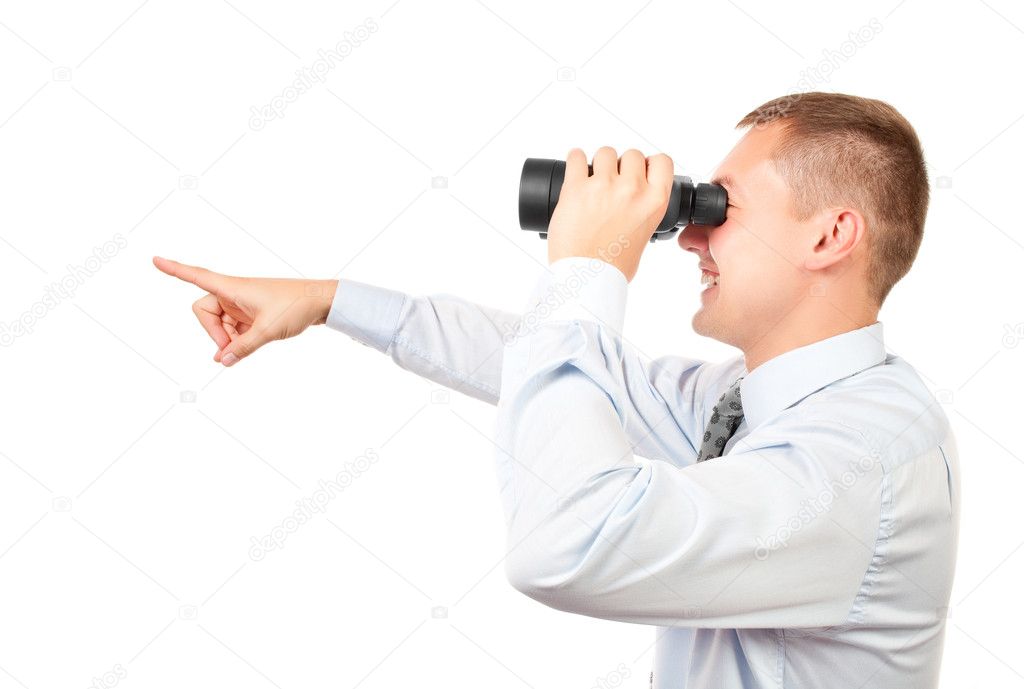 Businessman looking through binocular and is pointing forward