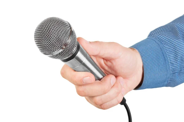 Presenter holding a microphone in hand — Stock Photo, Image