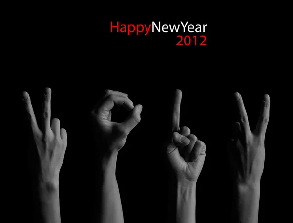 The number 2012 shown by fingers in creative New Year greeting c — Stok fotoğraf