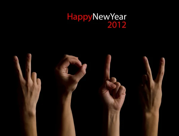 The number 2012 shown by fingers in creative New Year greeting c — Stock Photo, Image