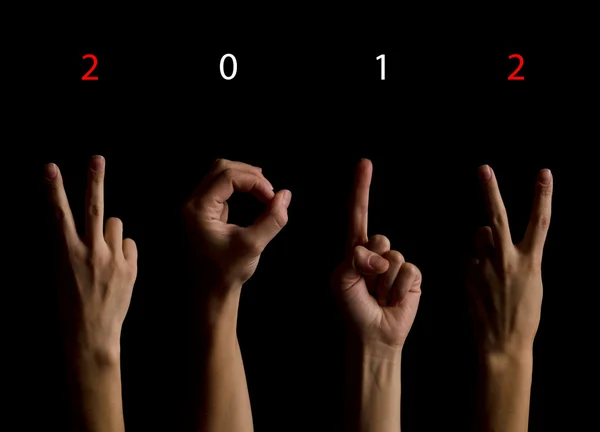 The number 2012 shown by fingers in creative New Year greeting c — Stock Photo, Image