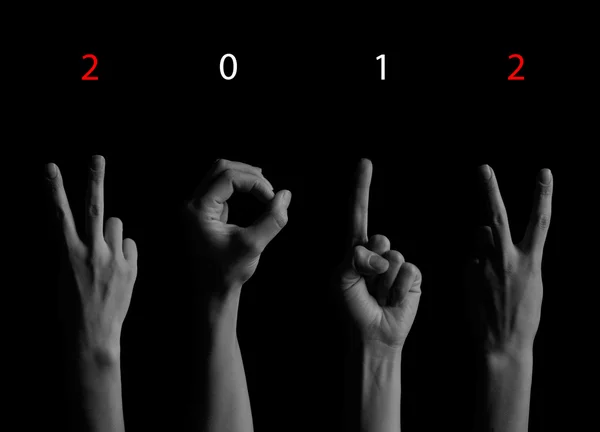 Ο αριθμός 2012 φαίνεται από τα δάχτυλα στο δημιουργικό νέο έτος, Χαιρετισμός c — Φωτογραφία Αρχείου