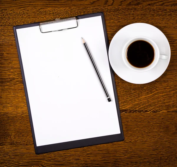Clipboard with blank page and cup of coffee — Stock Photo, Image