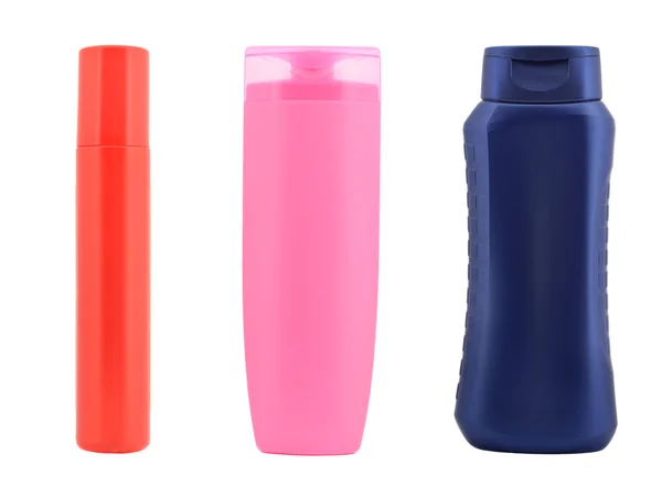 Trzy kolorowe butelki z tworzyw sztucznych — Zdjęcie stockowe