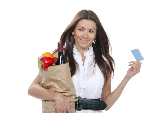 Woman with shopping bag full of groceries and credit card — Stock Photo, Image
