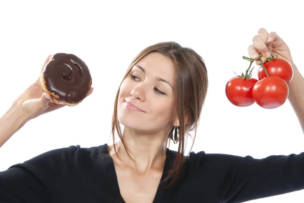 Healthy eating food concept woman donut tomatoes — Stock Photo, Image