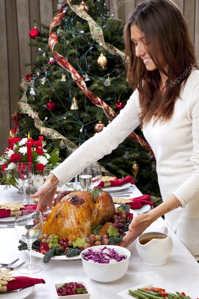 Woman with Garnished Christmas roasted turkey