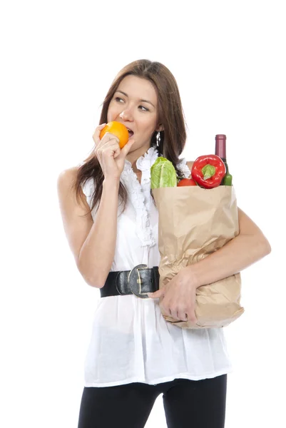 Woman hold shopping paper bag full of vegetarian groceries — Stock Photo, Image