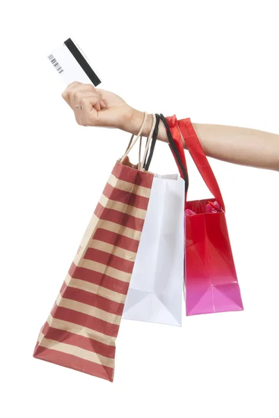Bevásárló szatyrok és ajándék hitelkártya kéz — Stock Fotó