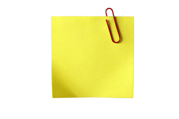 Yellow sticky paper with red clip. Isolated on white background