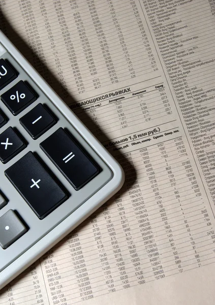 Calculator on business newspaper close up. Financial concept. — Stock Photo, Image
