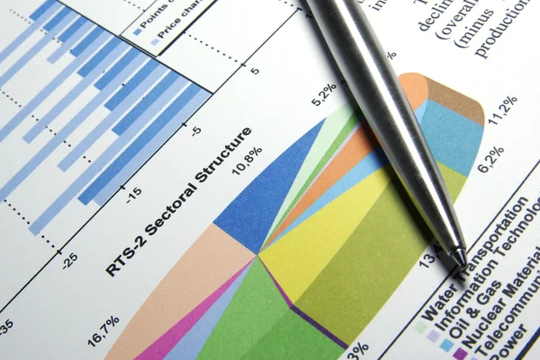 Steel pen laying on printed diagram. — Stock Photo, Image