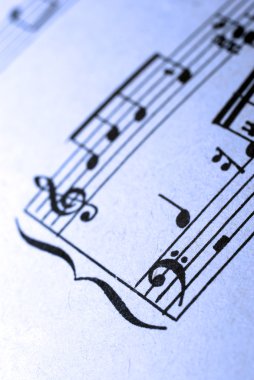 Closeup of old musical sheet's fragment. clipart