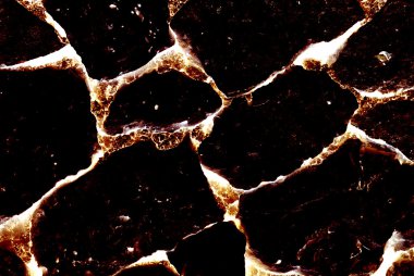 Close-up of burnt volcanic stone. Abstract textured background. clipart