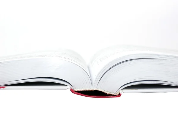 Livro aberto isolado no fundo branco . — Fotografia de Stock