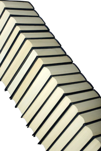 Hoher Stapel alter klassischer Bücher isoliert auf weißem Hintergrund. — Stockfoto