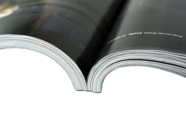 Geöffnete Zeitschrift Nahaufnahme auf weißem Hintergrund. — Stockfoto