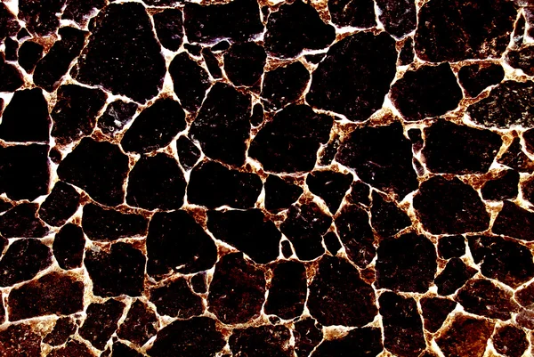 Verbrande vulkanische steen abstract gestructureerde achtergrond. — Stockfoto