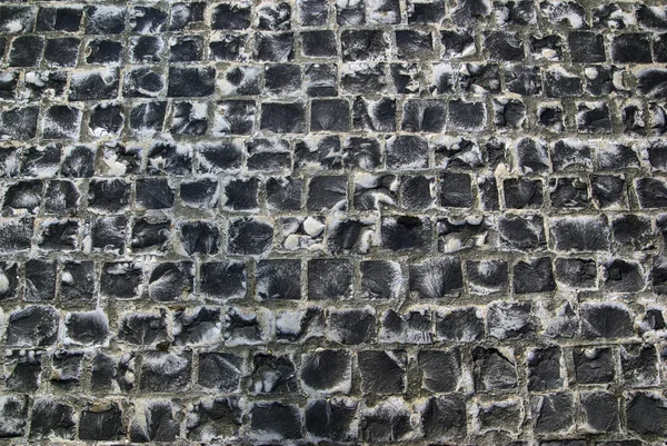 Oude weg gemaakt van stenen bakstenen. abstracte textuur achtergrond. — Stockfoto