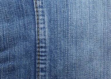 Blue jeans with yellow stitches vertically. Can be used as backg clipart