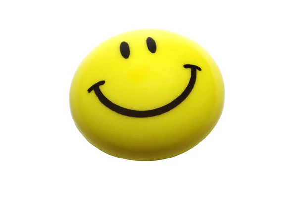 Żółty uśmiechający się magnes na białym tle. — Zdjęcie stockowe
