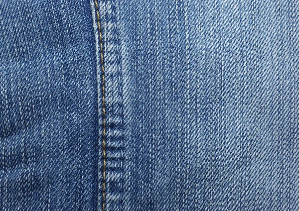 Blue jeans with yellow stitches vertically. Can be used as backg — Stock Photo, Image