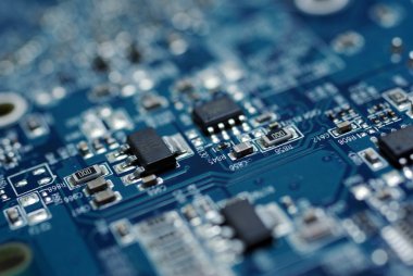 Close up photo of blue PC circuit board. clipart