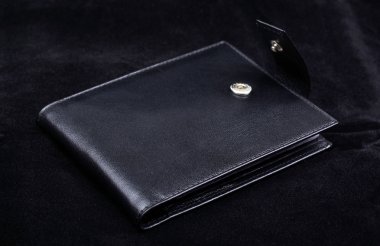 Macro of high quality wallet isolate on black velvet background. clipart