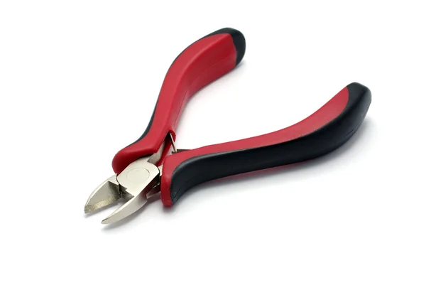 Rood met zwarte snijden tangen geïsoleerd op wit met schaduw. — Stockfoto